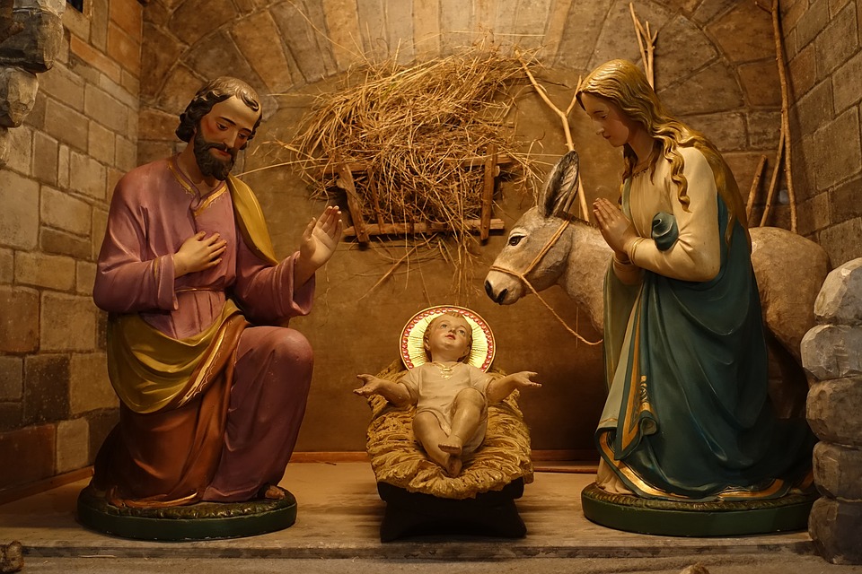 Depiction of the Holy Family. Joseph and Mary honouring the Baby Jesus.