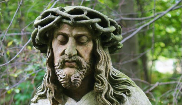 Christ the King stone statue of Jesus Christ with a crown of thorns